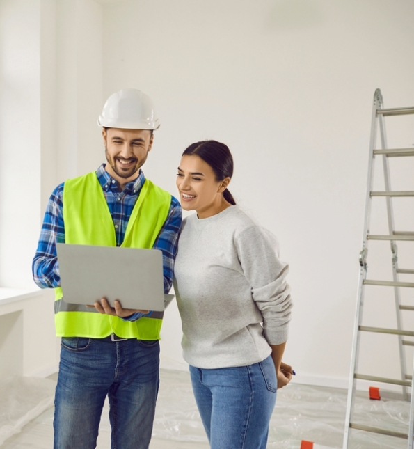 construction worker talking to homeowner