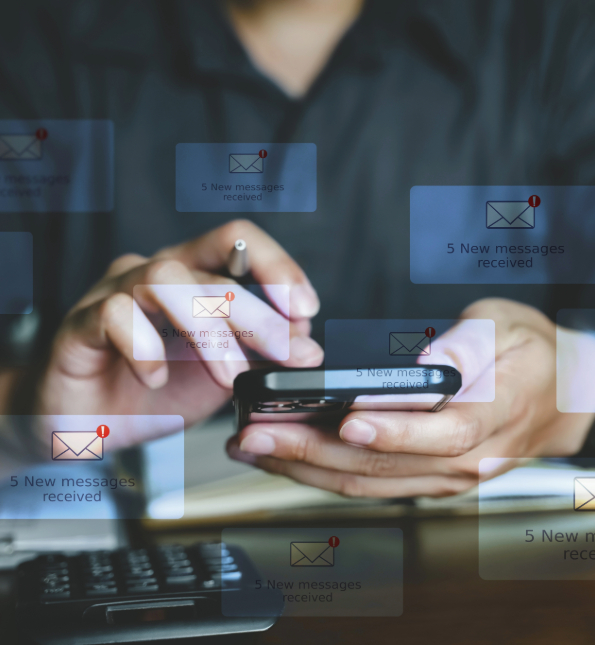 man on cellphone with phishing graphics