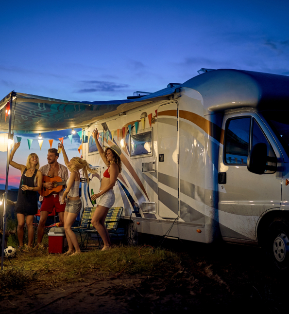 people partying next to camper