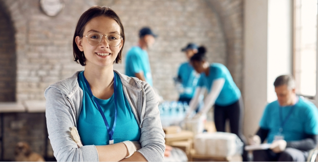 woman standing in front of volunteers