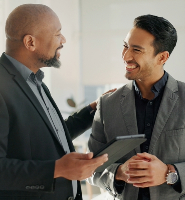 two business men laughing with each other