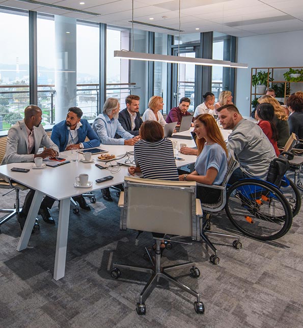 Large group of people in an office conference room.