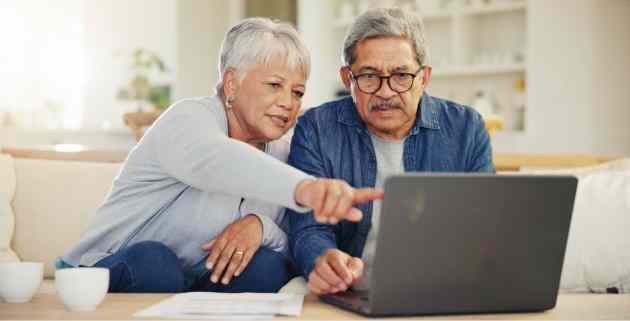 older couple looking at laptop