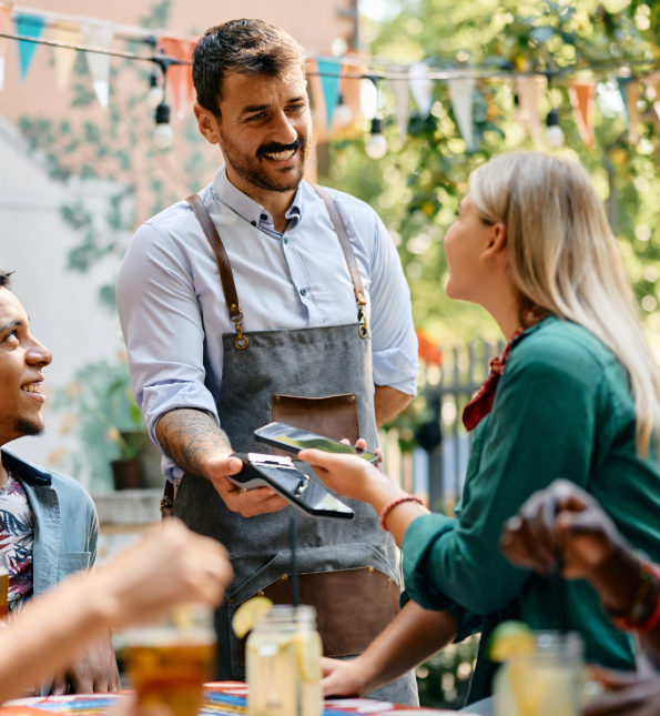 person at restaurant using tap to pay