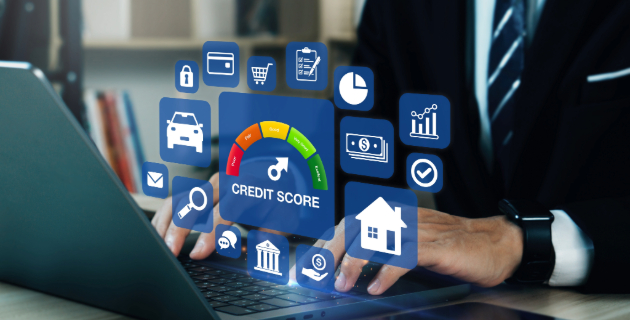 person using laptop reviewing their credit score