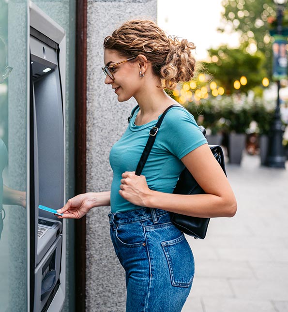 Woman using ATM
