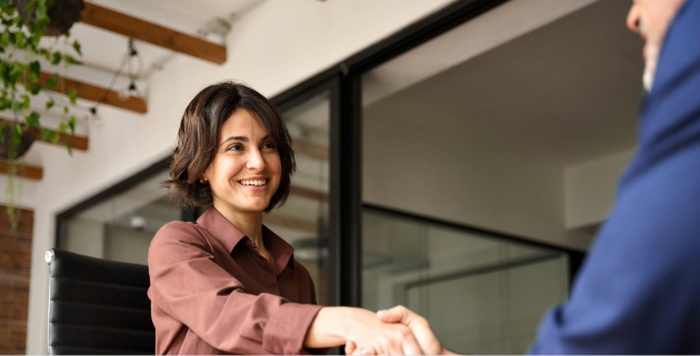 woman shaking hands with man